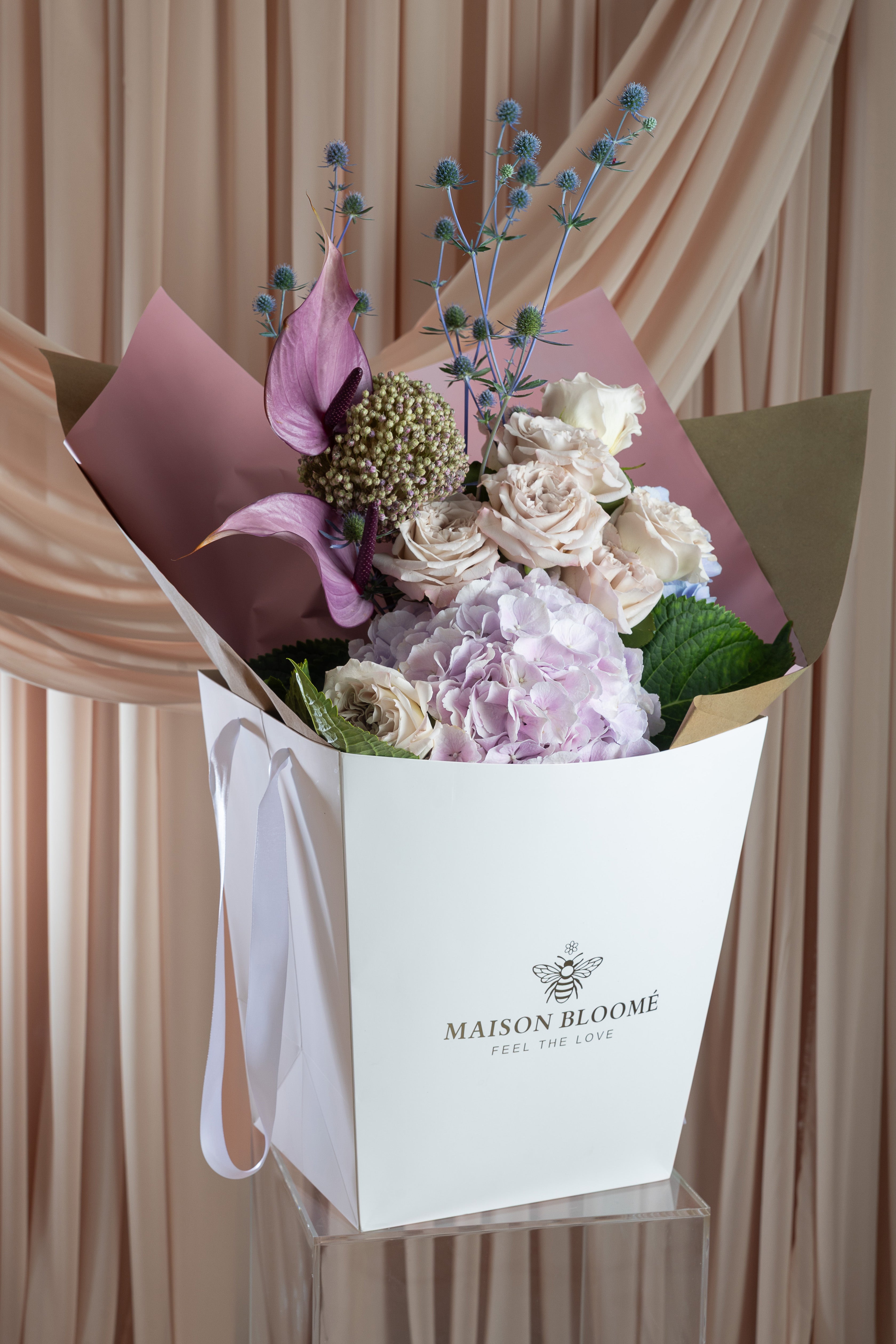Blush flower arrangement in signature bag Maison Bloomé Adelaide florist