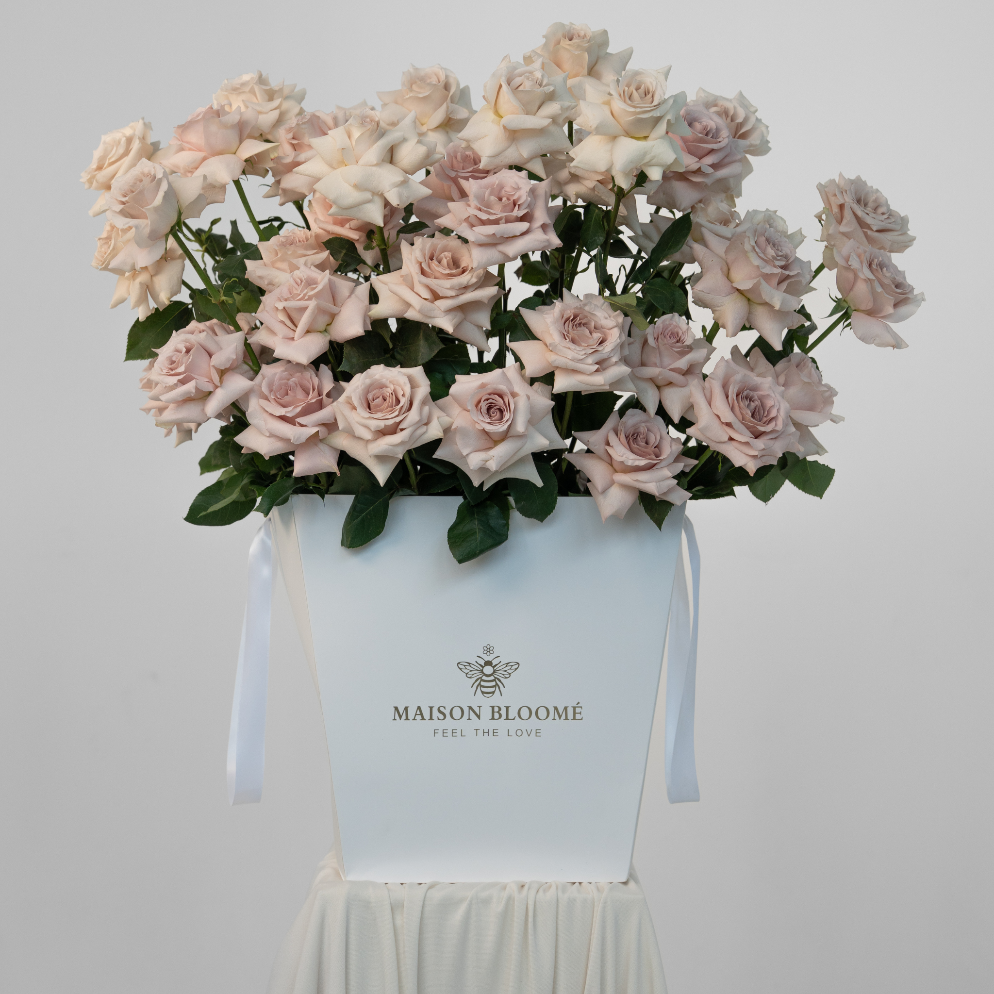 Luxury rose arrangement in signature bag Adelaide florist same day delivery Maison Bloomé