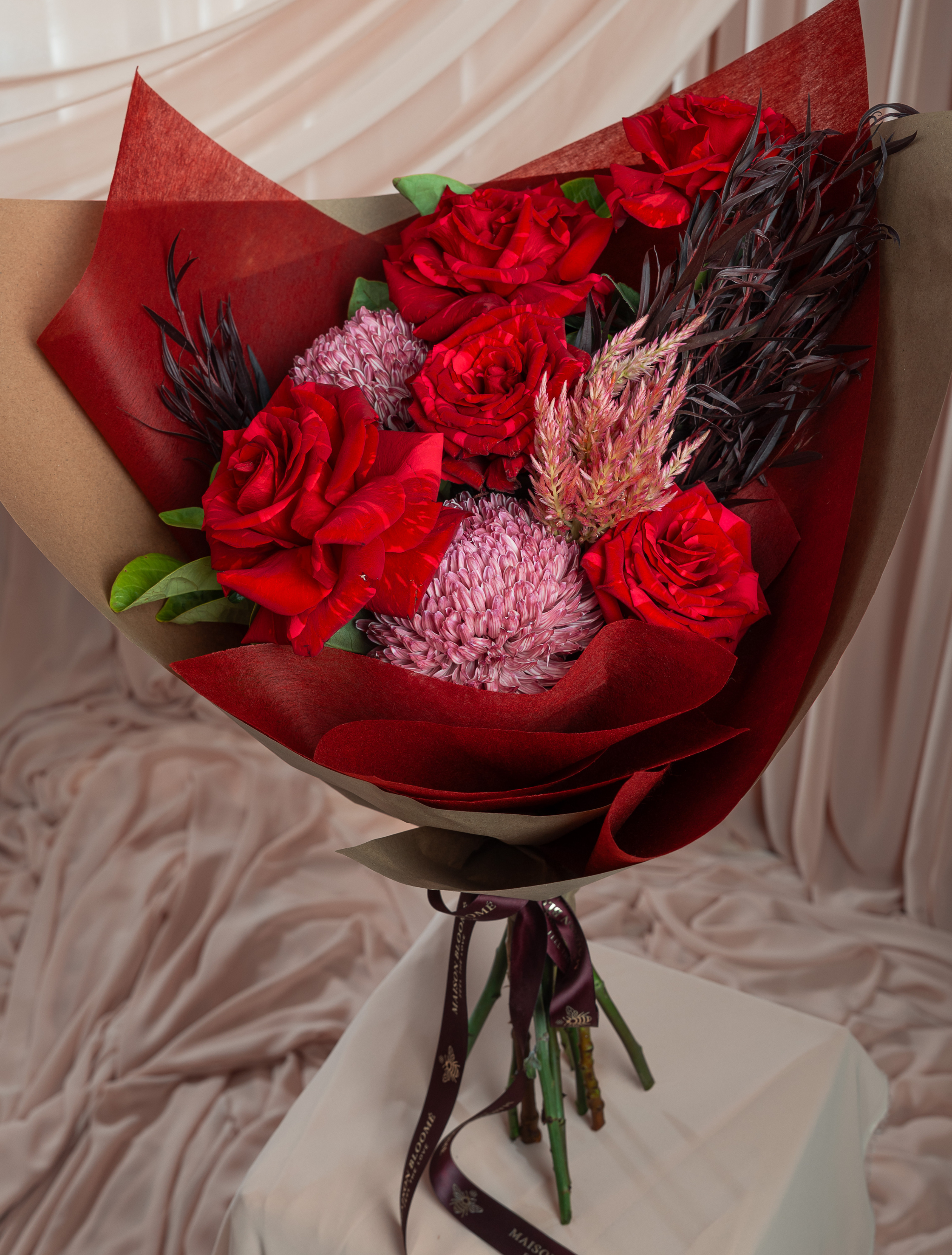 Premium red rose bouquet with seasonal textures by Maison Bloomé Adelaide florist same day delivery