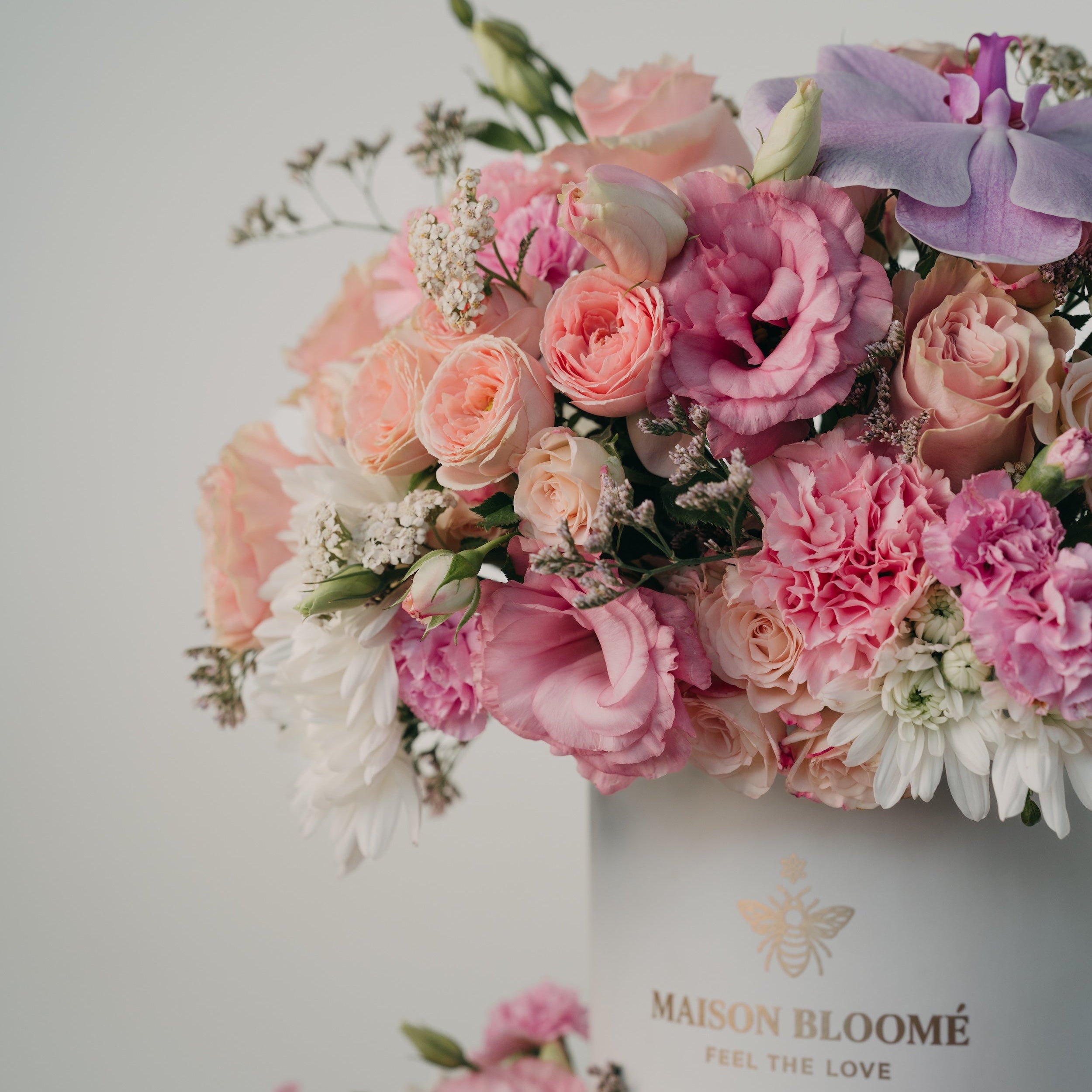 Detail of soft pastel flower arrangement with roses and lisianthus by Maison Bloomé florist Adelaide